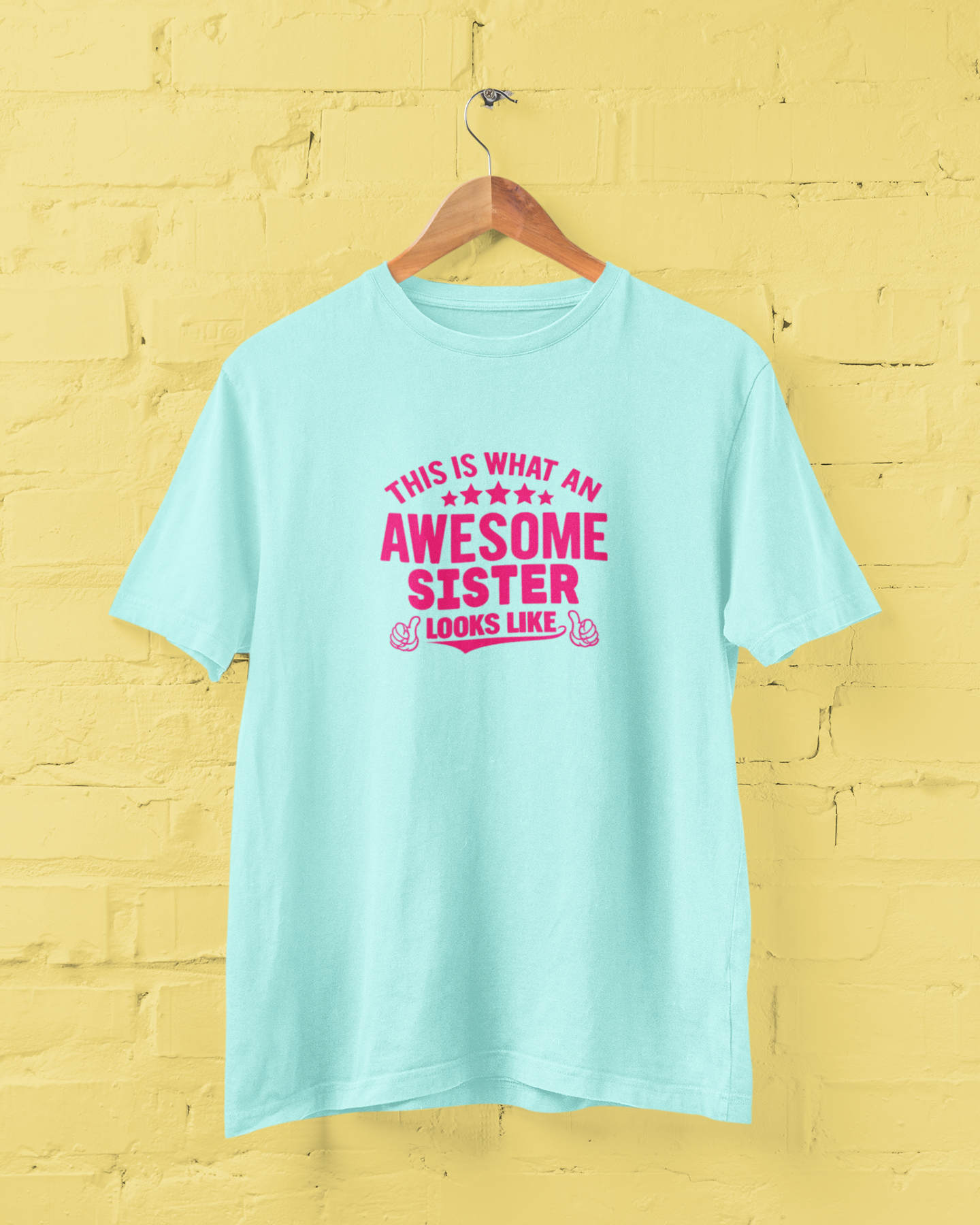 Awesome Sister Mint T-Shirt for Women featuring "This Is What an Awesome Sister Looks Like" quote in bold pink typography with thumbs-up graphics. Funny sister graphic tee and perfect birthday gift for sisters. Available in sizes S-7XL - sigmatrends