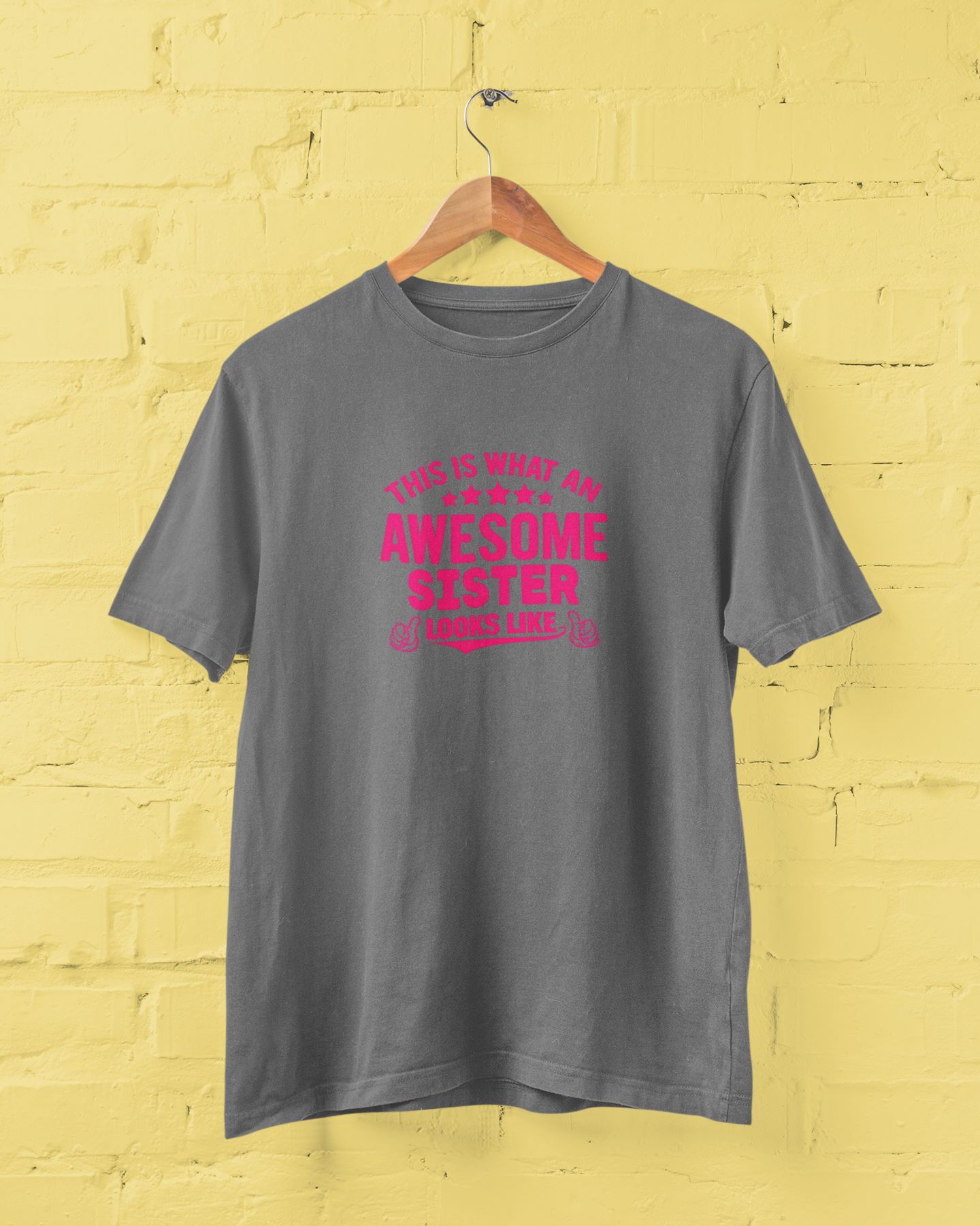 Awesome Sister Grey T-Shirt for Women featuring "This Is What an Awesome Sister Looks Like" quote in bold pink typography with thumbs-up graphics. Funny sister graphic tee and perfect birthday gift for sisters. Available in sizes S-7XL - sigmatrends